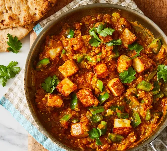 Paneer curry with green peppers and fresh naan, a vegetarian favourite at Shehnai Restaurant on Main Street West, Hamilton